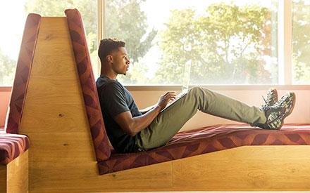 A UB student on a laptop